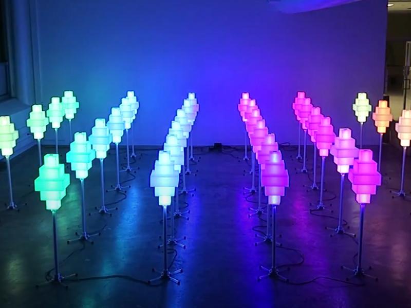 A series of colored lamps that change colors via human interaction.